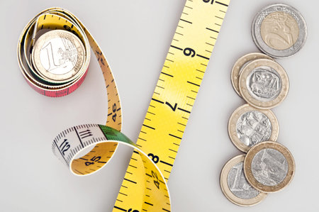 Money stack and measuring tapeの写真素材