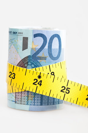 Money stack and measuring tape