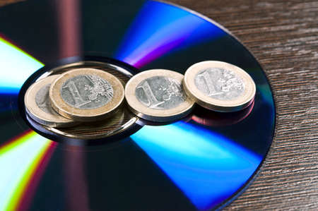 Group of euro coins on cd-romの写真素材