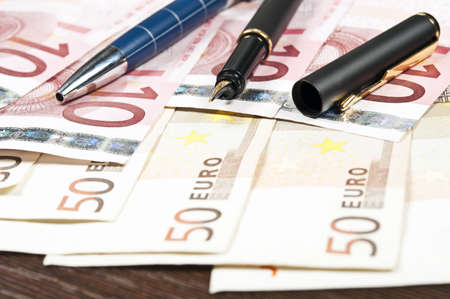 Two pen on euro banknotesの写真素材
