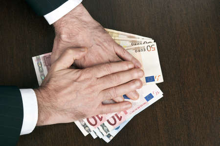 Business man hands on euro banknotesの写真素材