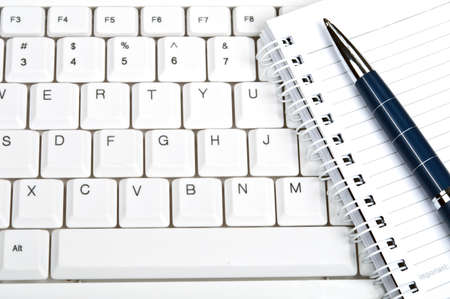 Notebook on an white keyboardの写真素材