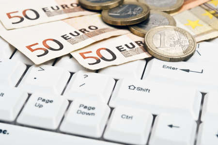 Money on an white keyboardの写真素材