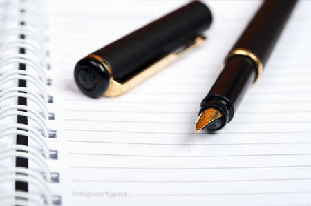 Notebook and luxury black penの写真素材
