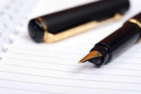 Notebook and luxury black penの写真素材