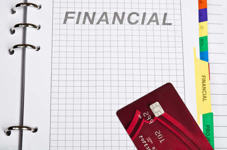 Notebook on financial page and credit cardの写真素材