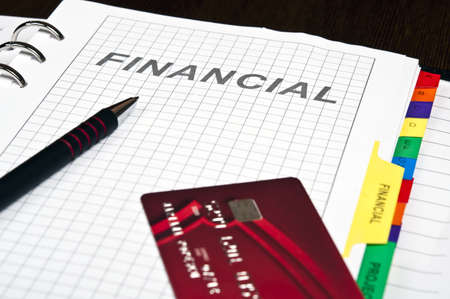 Notebook on financial page and credit cardの写真素材