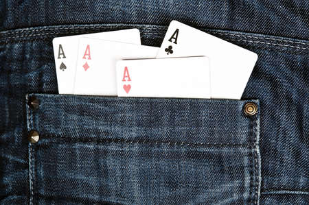 Closeup to jeans pocket with game cardsの写真素材