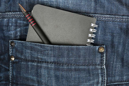 Closeup to jeans pocket with notebookの写真素材