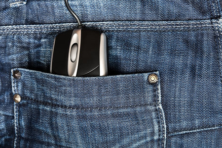 Jeans pocket closeup with pc mouseの写真素材