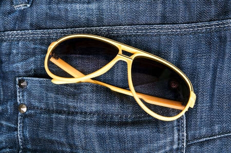 Jeans pocket closeup with sun glassesの写真素材