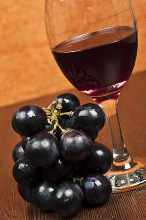 Red wine glass and grapesの写真素材