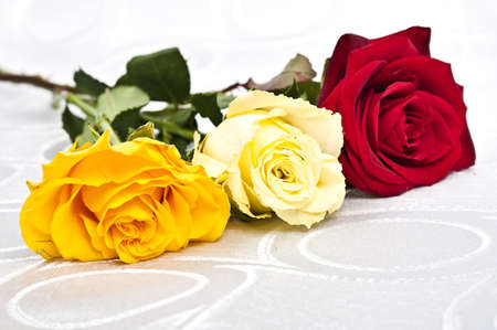 Rose bouquet on white silkの写真素材