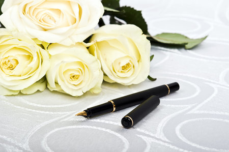 White roses and luxury penの写真素材