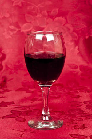 Red wine on red silkの写真素材