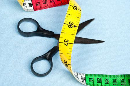 Scissors on blue material backgroundの写真素材