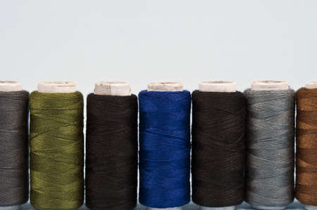 Thread on blue material backgroundの写真素材