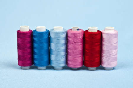 Thread on blue material backgroundの写真素材