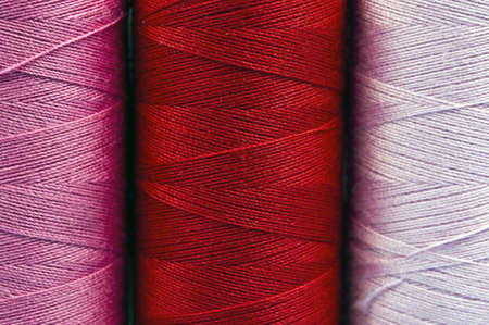 Background with red and pink threadの写真素材