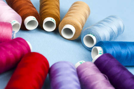 Thread on blue material backgroundの写真素材