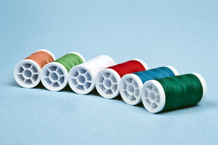 Thread on blue material background