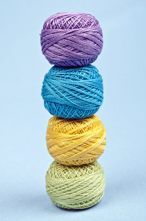 Thread on blue material backgroundの写真素材