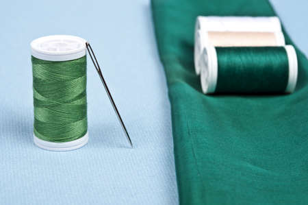 Thread on blue material backgroundの写真素材