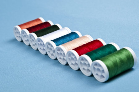 Thread on blue material background