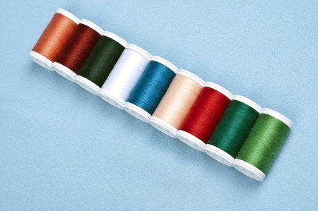 Thread on blue material background