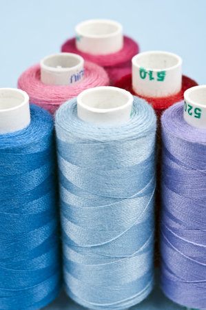 Thread on blue material background