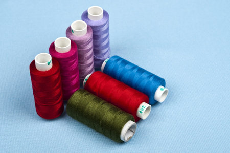 Thread on blue material background