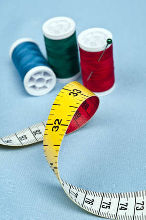 Tailor tools on blue material backgroundの写真素材