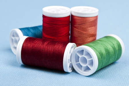 Thread on blue material backgroundの写真素材