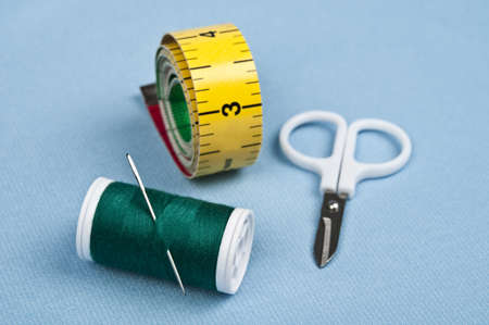 Tailor tools on blue material backgroundの写真素材