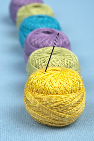 Thread on blue material background