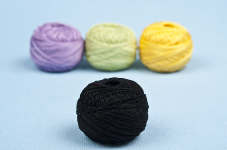 Thread on blue material backgroundの写真素材