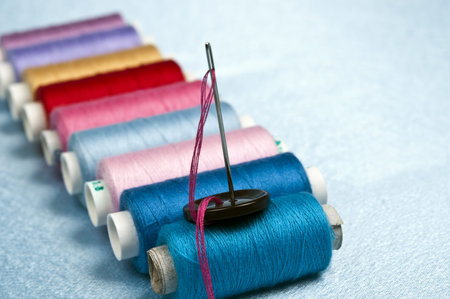 Thread on blue material background