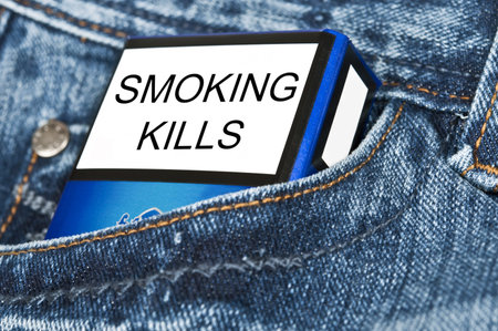 Cigarettes in blue jeans pocketの写真素材