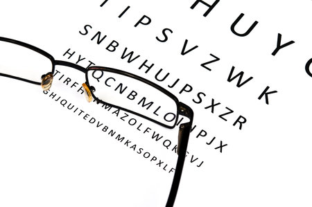 Eye glasses on examination paper
