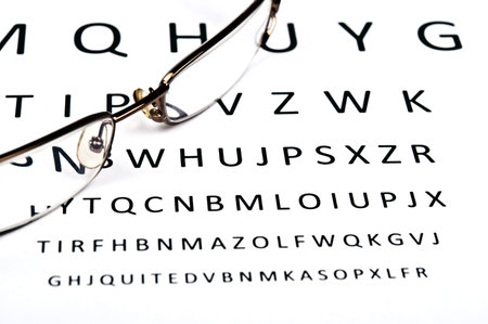 Eye glasses on examination paper