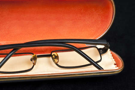 Eye glasses on black materialの写真素材