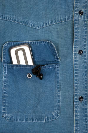 Jeans shirt pocket with phoneの写真素材