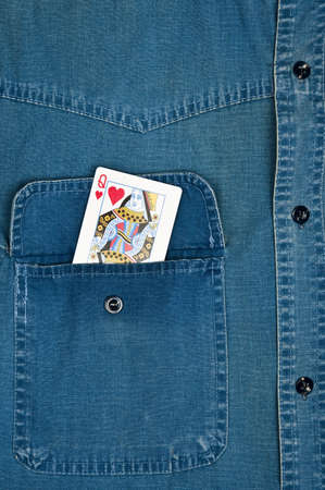 Jeans shirt pocket with queen cardの写真素材