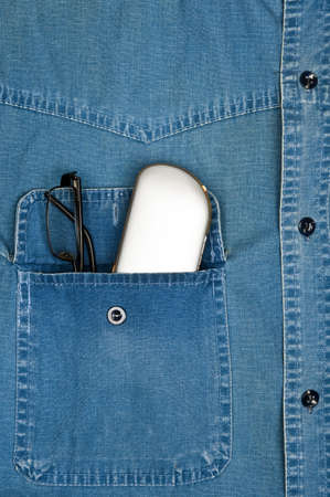 Jeans shirt pocket with eye glassesの写真素材