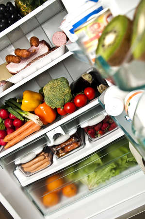 Refrigerator full of food close upの写真素材