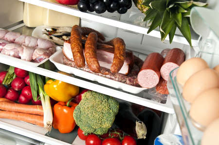 Refrigerator full of food close upの写真素材