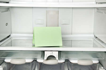 Refrigerator close up with empty noteの写真素材