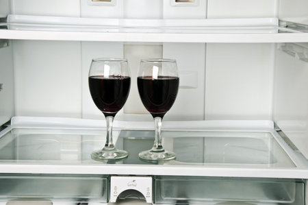 Refrigerator close up with wine glasses