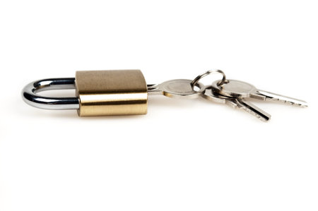 Padlock and keys on white