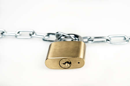 Padlock and chain on whiteの写真素材
